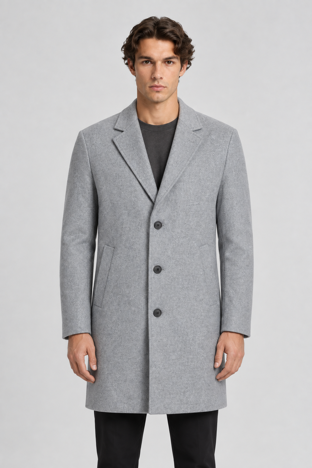 Vooraanzicht van een mannelijk model met de lichtgrijze Jack & Jones Wollen Mantel Harrison met revers en schuine zakken